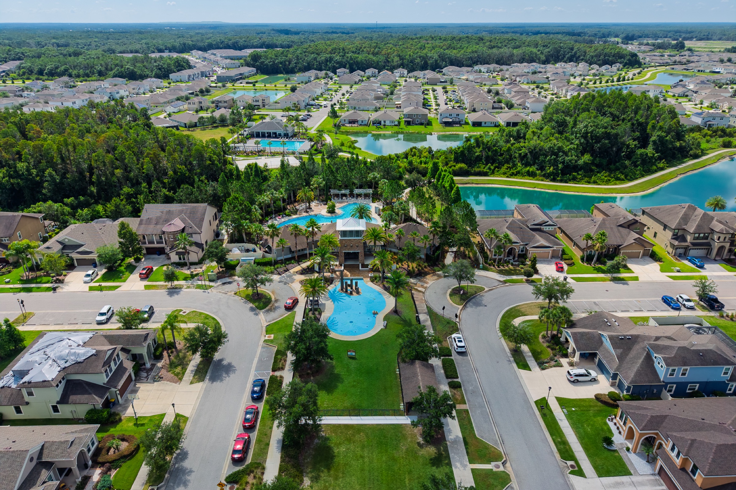 Aerial drone photography Tampa Bay FL — residential community with pool and waterways