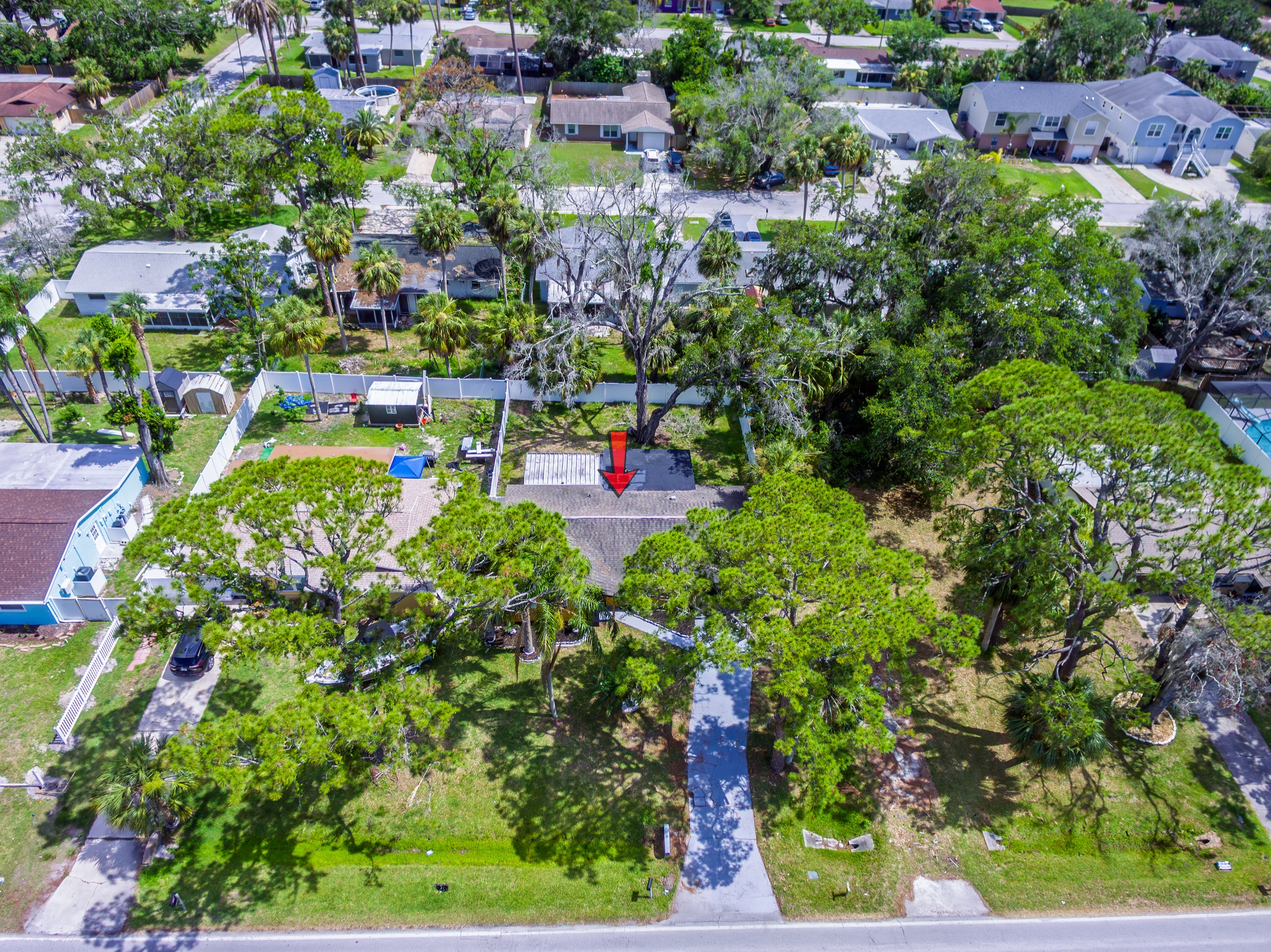 Drone aerial photography Tampa Bay — residential neighborhood overhead view showing proximity to water