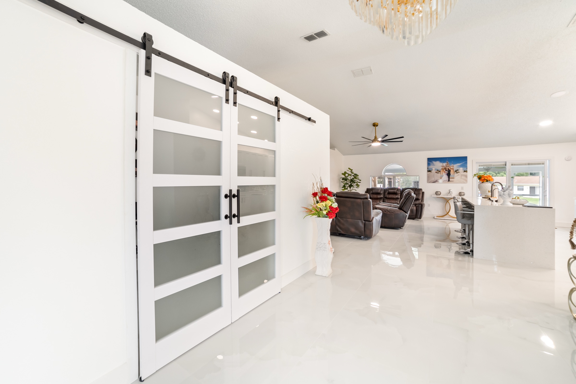 Real estate interior photography Tampa — luxury modern renovation with sliding barn doors
